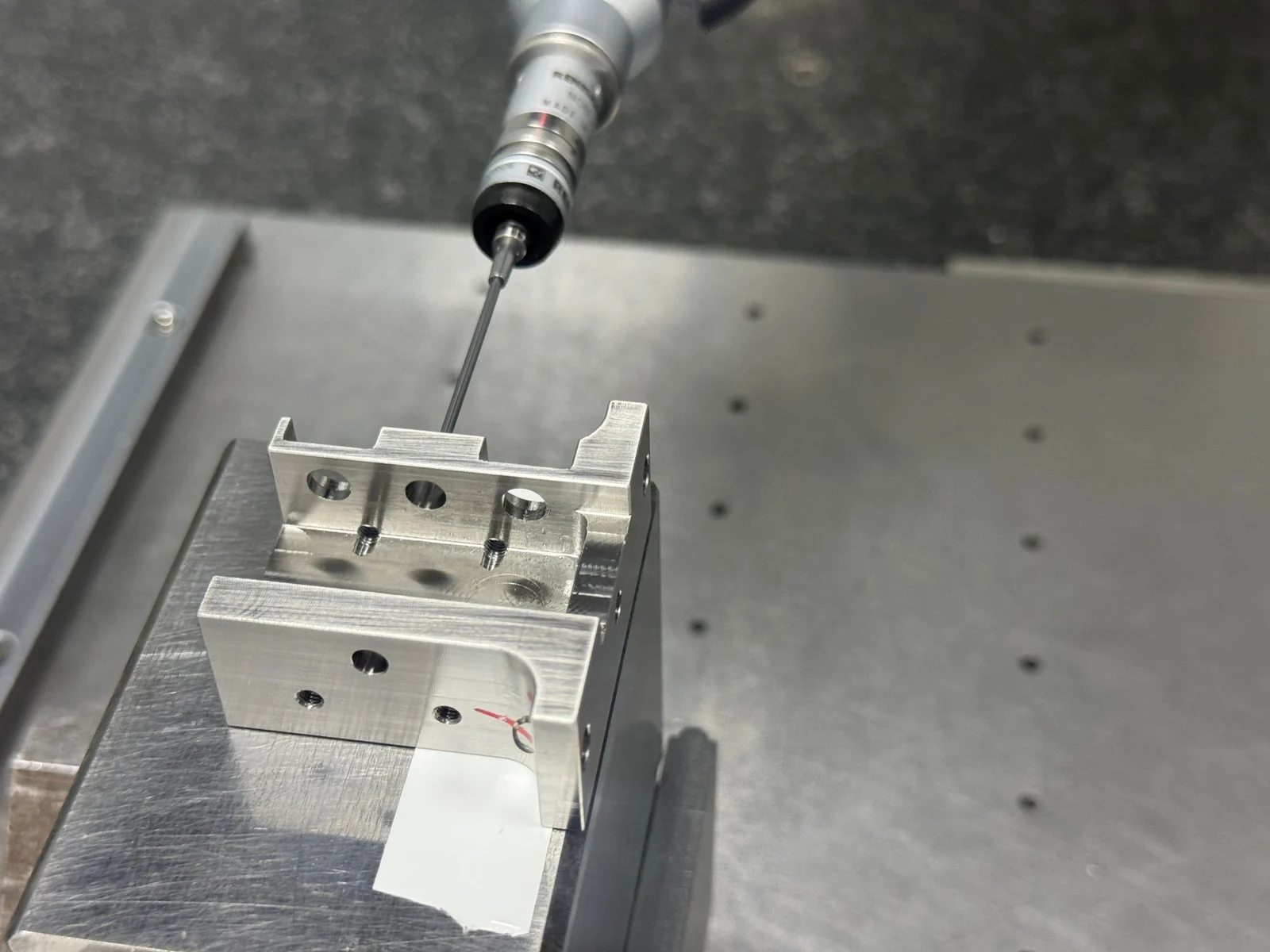 CMM probe inspecting the finished multi-face 304 stainless steel component