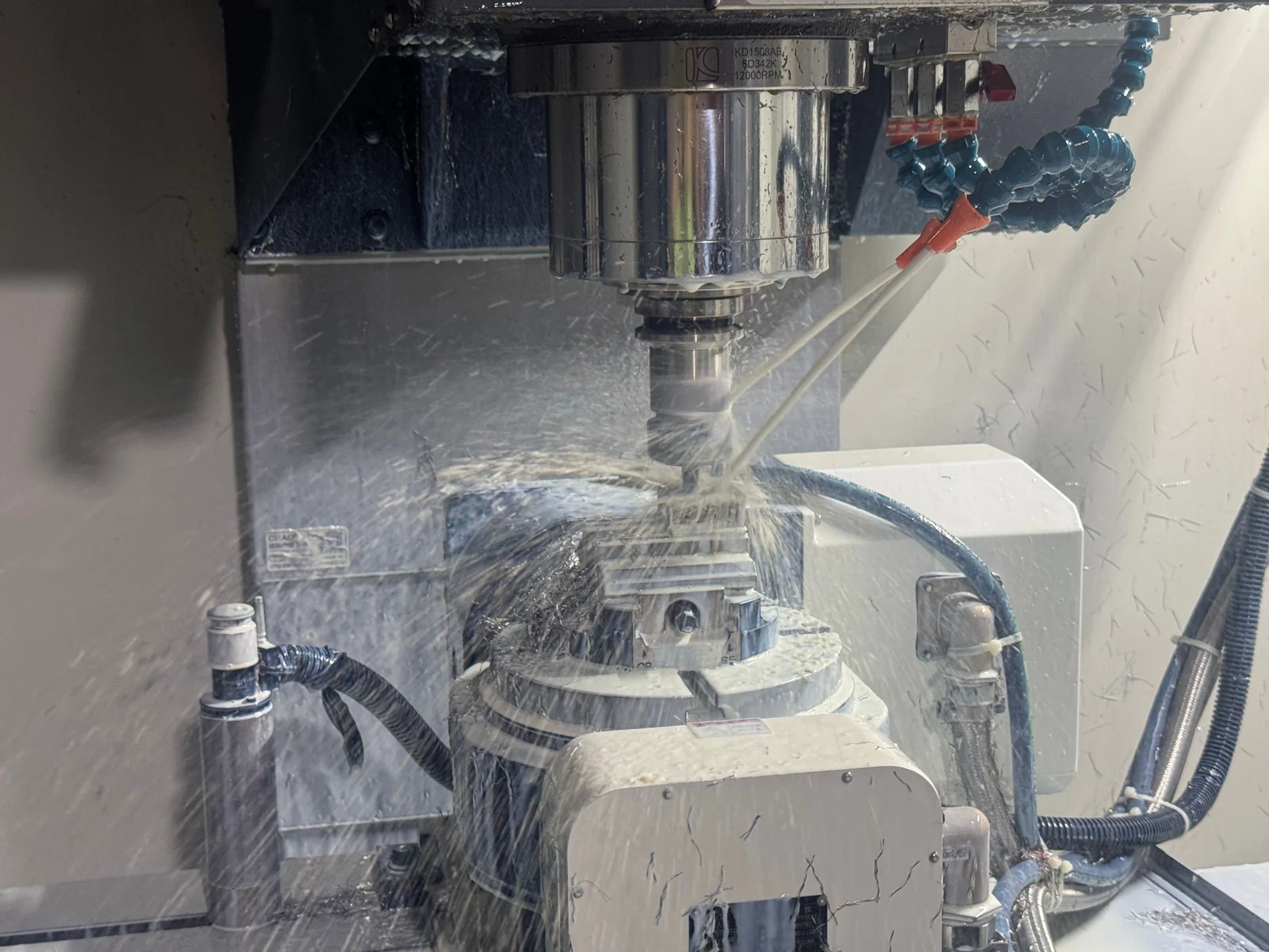 The fixtured stainless steel part at another indexed cutting orientation