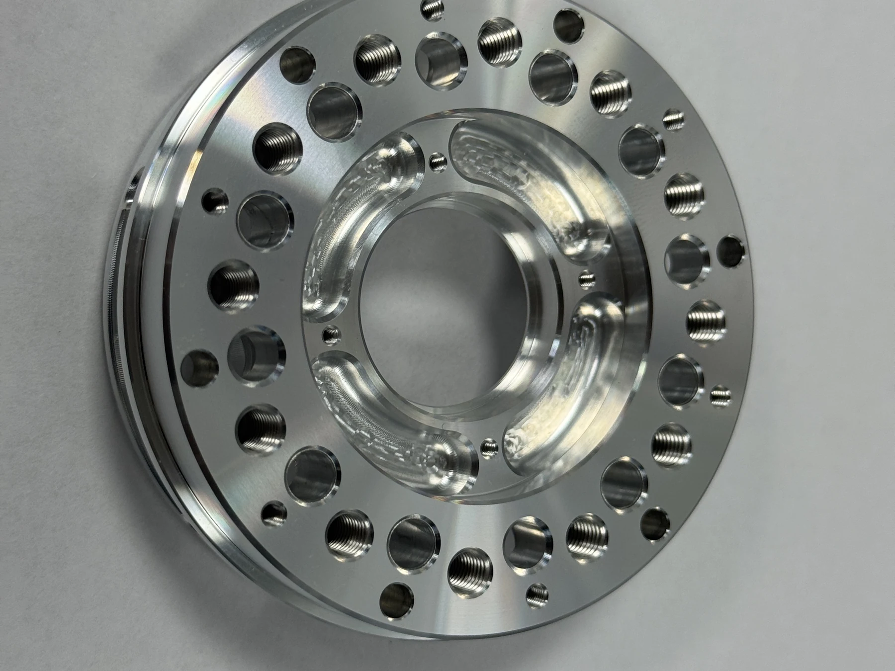 Front face of a finished 7075-T6 aluminum second-stage planet carrier for an industrial robot reduction gearbox