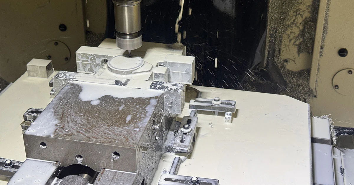 One anonymized AerMet 100 component in the FANUC ROBODRILL finish-milling setup