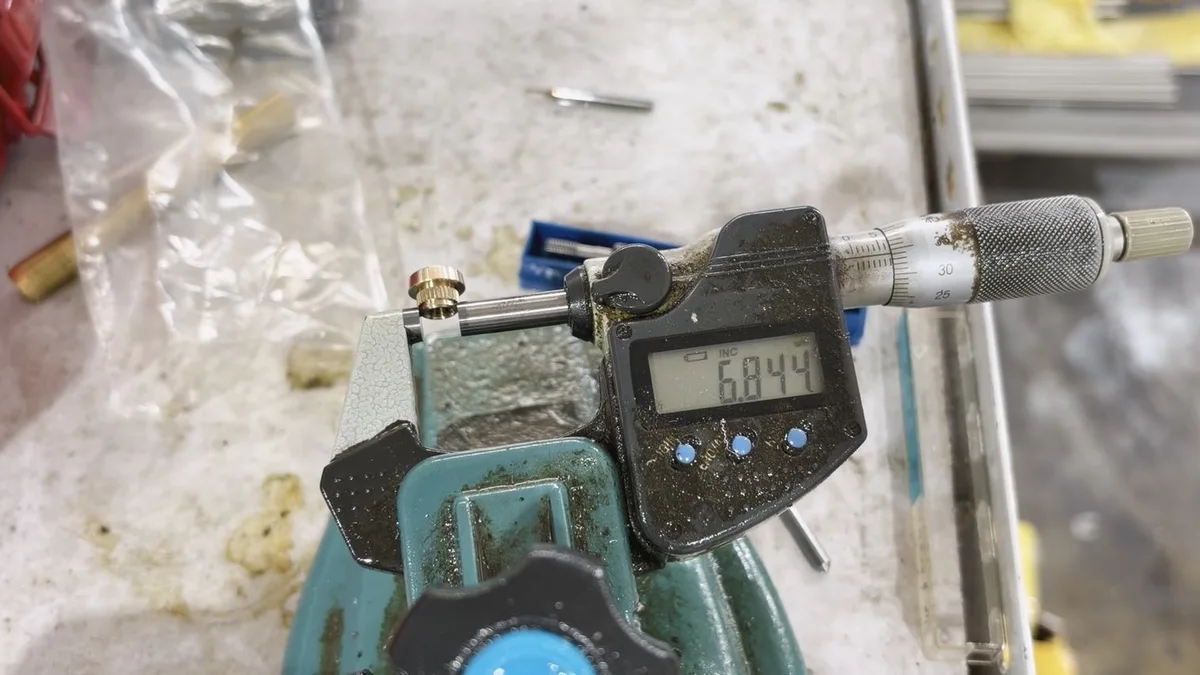 Micrometer inspection of the actual C3604 brass part during production