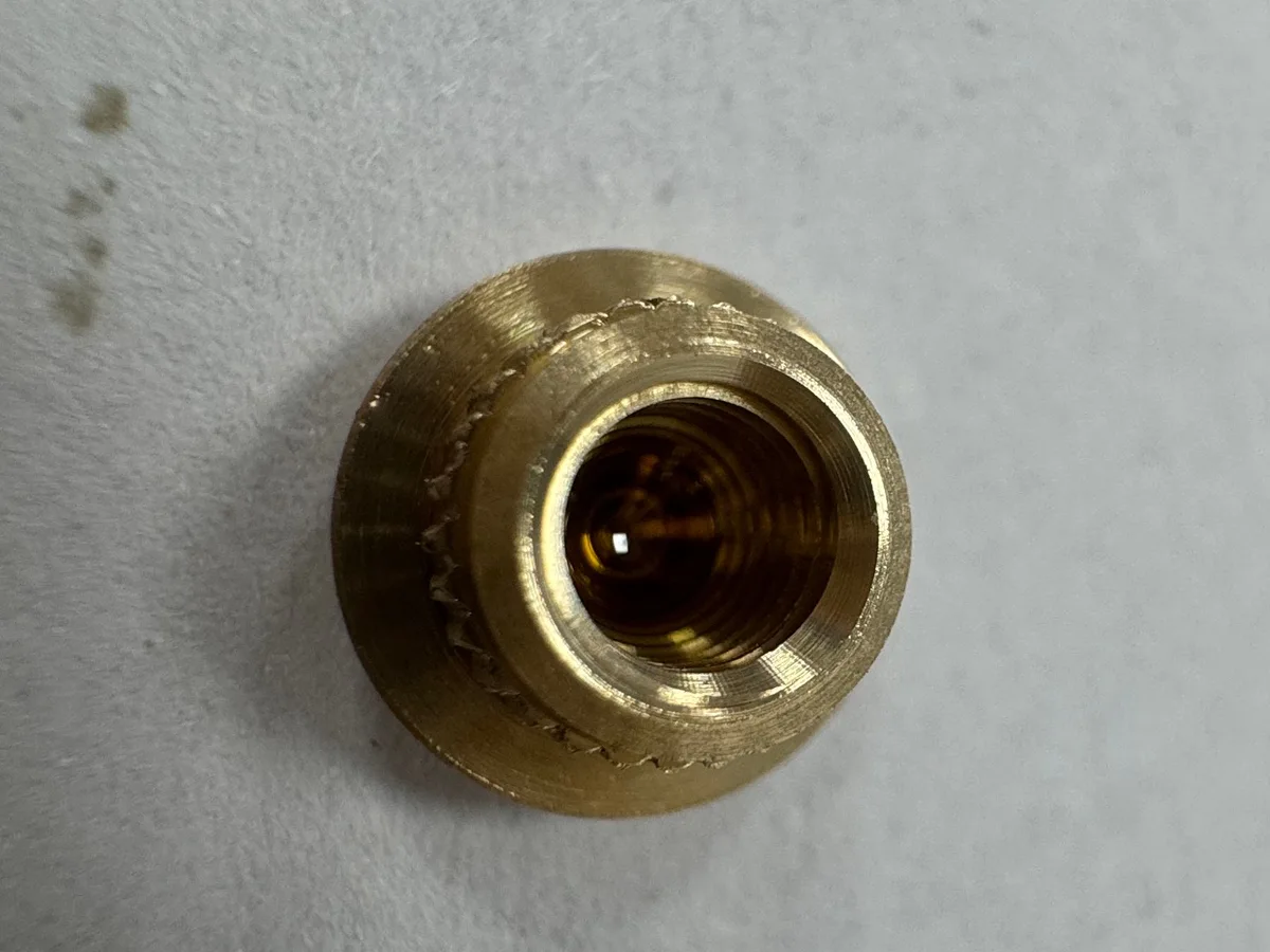 Front view of the actual C3604 brass part showing the internal thread and stepped outer geometry