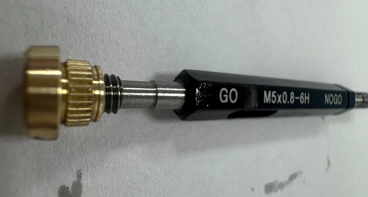Actual C3604 brass part on a thread gauge marked M5 × 0.8-6H
