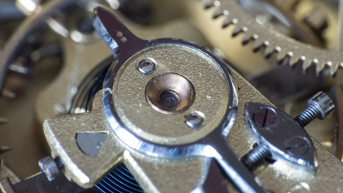 Close-up of miniature gears, shafts and screws in a precision mechanism