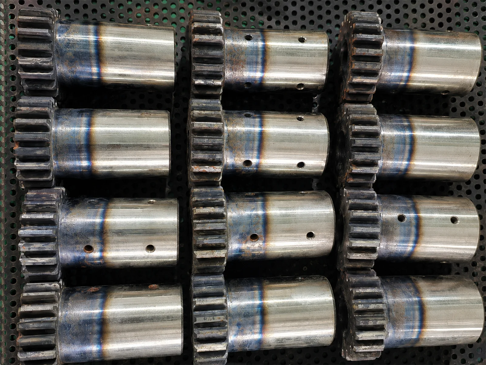 Controlled industrial heat treatment of precision metal components