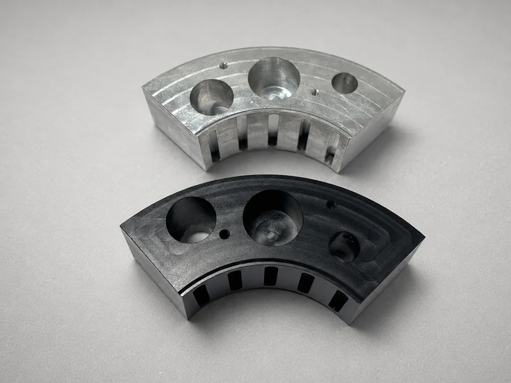 Aluminum alloy production parts before and after black hardcoat anodizing
